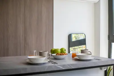 a table with two bowls of fruit on a counter at The Keep38 in Rhodes Town