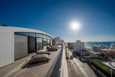 a balcony of a building with pillows on it at The Gem Loft City Apartment in Rhodes Town