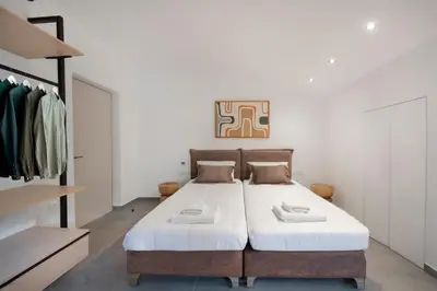 a bedroom with a large bed in a room at The Gem Loft City Apartment in Rhodes Town