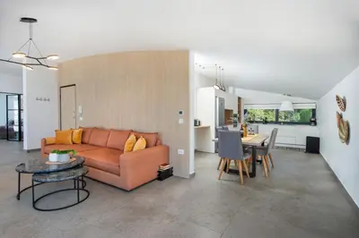 a living room with a couch and a table at The Gem Loft City Apartment in Rhodes Town