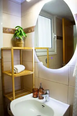 a bathroom with a sink and a mirror at The 20A Terminal Stay N Fly in Paradeísion