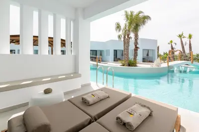a view of the pool from the living room of a resort at Martini Boutique Resort in Ialyssos