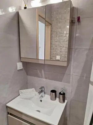 a bathroom with a sink and a mirror at EFReMIAS PLACE in Rhodes Town