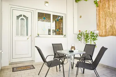 a dining room with a table and chairs at Malona Nostalgia in Malona Village
