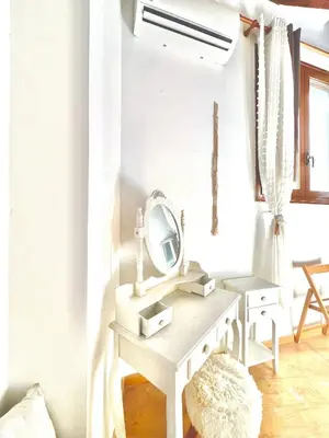 a bathroom with a white sink and a mirror at Rafaela suite old town in Rhodes Town