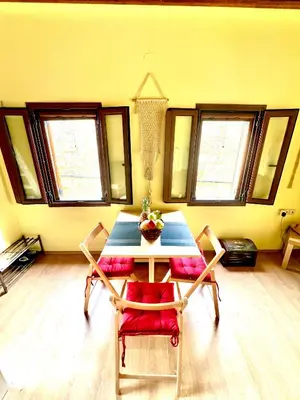 a dining room with a table and two chairs at Rafaela suite old town in Rhodes Town