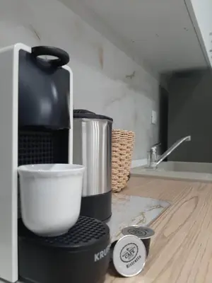 a coffee maker sitting on a counter in a kitchen at Pixel Palace in Rhodes Town
