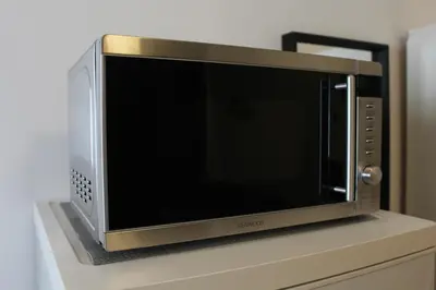 a microwave oven sitting on top of a counter at Κatholikis Room in Kremasti