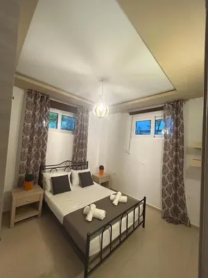 a bedroom with a bed with two towels on it at Casa Guina Solis in Rhodes Town