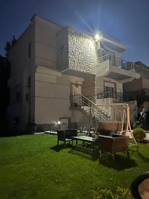 a house with a lawn in front of it at Casa Guina Solis in Rhodes Town