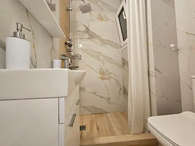 a bathroom with a sink and a shower at Elegant Aesthetic Suites in Rhodes Town