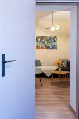 a living room with a couch and a table at Eviona Iris in Rhodes Town