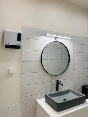 a bathroom with a sink and a mirror at Sofi's place in Ixia