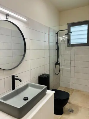 a bathroom with a sink and a toilet and a mirror at Sofi's place in Ixia