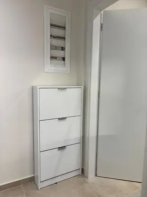 a white refrigerator in a room with a wall at Sofi's place in Ixia