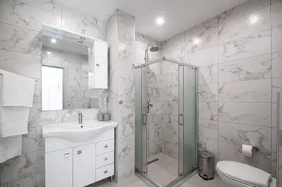 a bathroom with a shower and a sink and a toilet at Asterashouse 2 in Rhodes Town