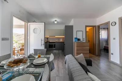 a living room with a couch and a table at Pelagos in Vrachonisída touArchangélou