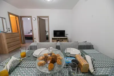 a table with a glass plate of food on it at Pelagos in Vrachonisída touArchangélou