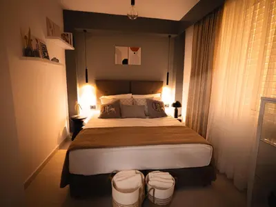 a bedroom with a large bed in a room at Sea Side Apartment Rhodes City Center in Rhodes Town