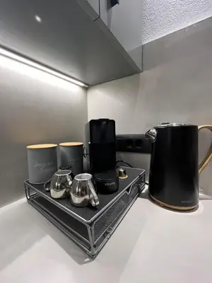 a tray with pots and pans on a kitchen counter at Sea Side Apartment Rhodes City Center in Rhodes Town