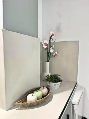 a table with a basket of eggs and a vase with flowers at Sea Side Apartment Rhodes City Center in Rhodes Town