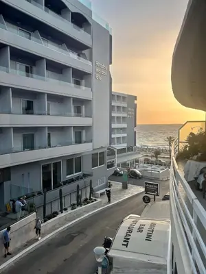 a view from a balcony of a hotel and the ocean at Sea Side Apartment Rhodes City Center in Rhodes Town