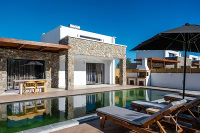 a villa with a swimming pool and a house at Brillante VIllas by Renthub in Kolimbia
