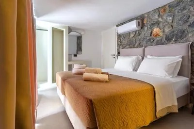 a bedroom with a large bed with a yellow blanket at Brillante VIllas by Renthub in Kolimbia