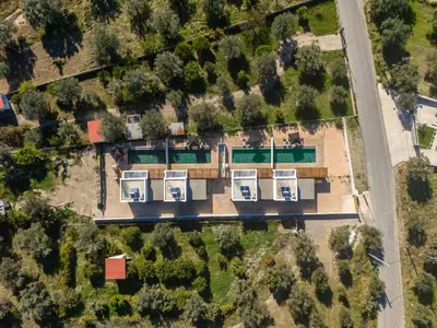 an overhead view of a building with four cars at Brillante VIllas by Renthub in Kolimbia
