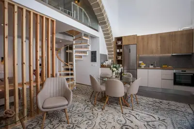a kitchen and dining room with a table and chairs at Nouvelle15 Cozy House with Private Pool in Koskinou