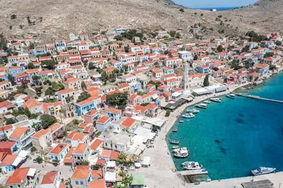 an aerial view of a town with boats in the water at Port Elegance Residence - Halki in Halki