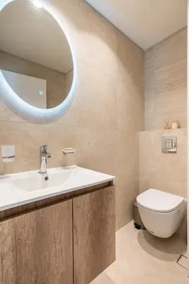 a bathroom with a sink and a toilet and a mirror at D&R Boutique Apartments Central in Rhodes Town