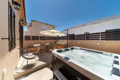 a hot tub on the balcony of a building at Rodos Aqua Luxury Villa in Rhodes Town
