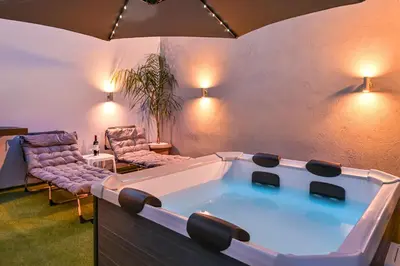 a living room with a pool table and chairs at Avli Village House with Private Jacuzzi in Paradeísion