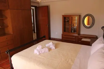 a bedroom with two towels on a bed at Despinas Village House in Kalavárda