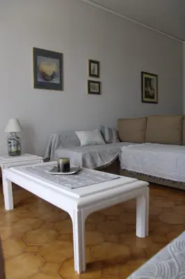 a living room with a couch and a coffee table at Despinas Village House in Kalavárda