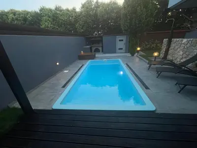 a swimming pool in a yard with a patio at Casa del Emma in Koskinou in Koskinou
