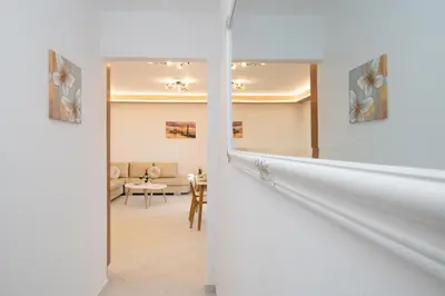 a hallway with a staircase leading to a living room at Casa Serena in Lardos