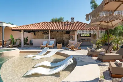 a backyard with a swimming pool with white slides at Vento Estivo Mansion in Pastida