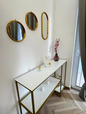 a dressing table in a room with mirrors at Valsamo Suite in Ialyssos