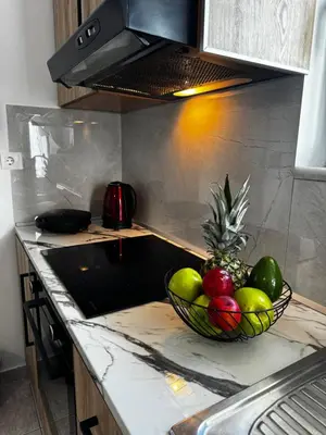 a bowl of fruit on a counter in a kitchen at Valsamo Suite in Ialyssos