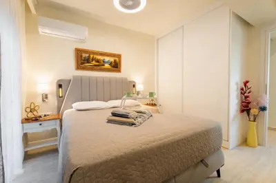 a bedroom with a large bed in a room at NiMar luxury city villa with jacuzzi in Rhodes Town