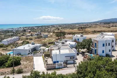 an aerial view of a town with white buildings and the ocean at Villa Milla in Gennadi