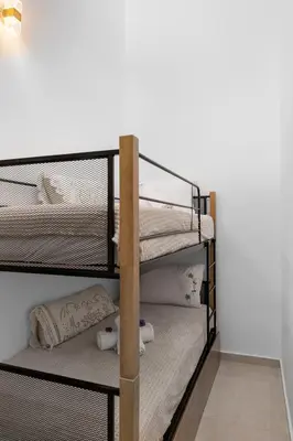 a bunk bed room with two bunk beds at VaSteka House 2 in Haraki