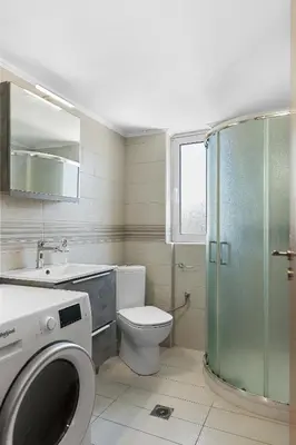 a bathroom with a toilet sink and a shower at City Central Appartment in Rhodes Town