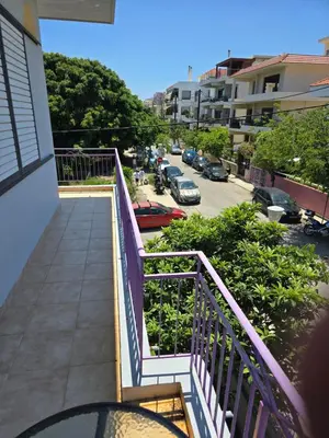 a balcony of a building with a view of a parking lot at City Central Appartment in Rhodes Town