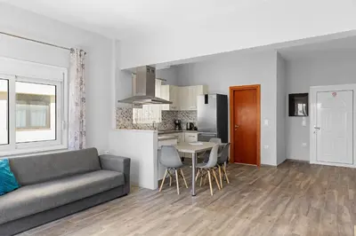 a living room with a couch and a table at City Central Appartment in Rhodes Town