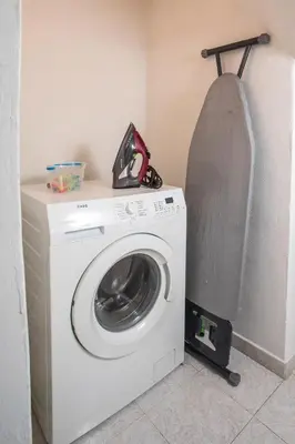 a washer and dryer in a corner of a room at Casa Platoni in Apolakkiá