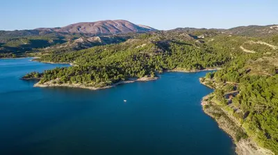an aerial view of a lake in the mountains at Casa Platoni in Apolakkiá