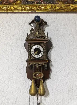 a clock is hanging on a wall at Levent Traditional Villa Rhodes Castle in Rhodes Town